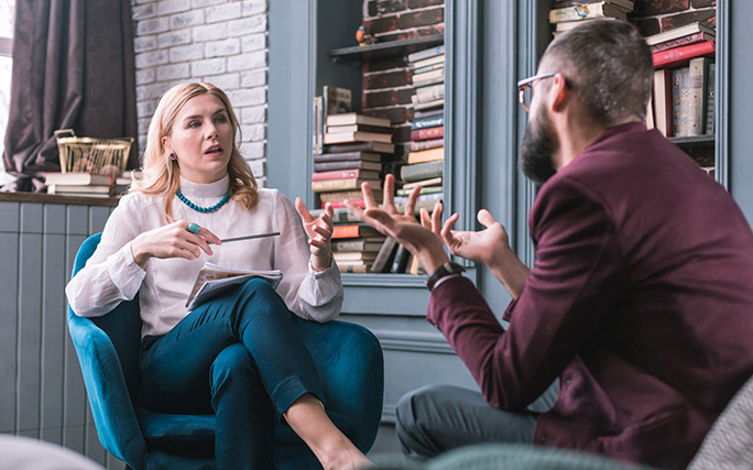 Counselor and patient conversing