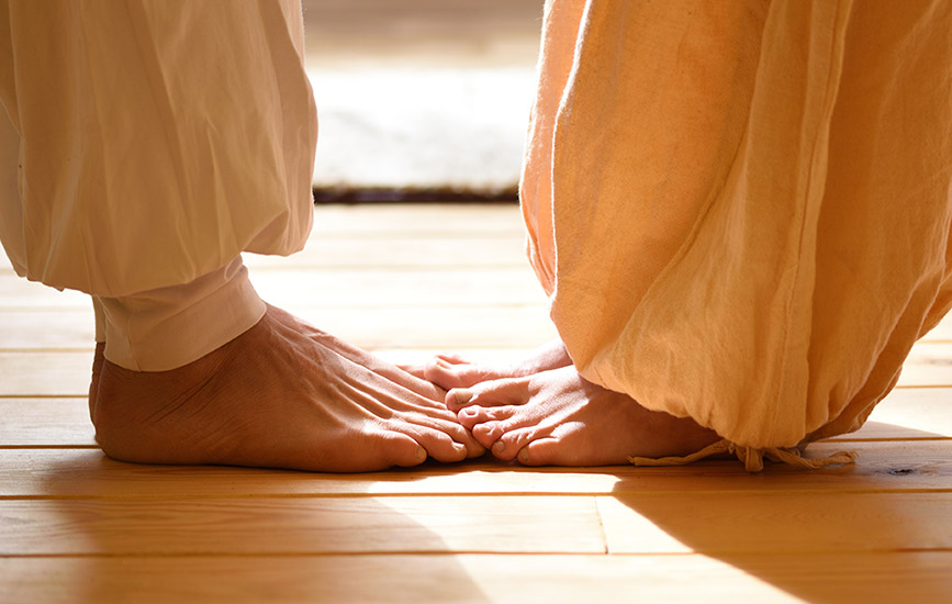 Close up of a couple's feet, standing face to face