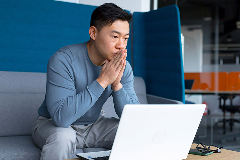 Man looking at laptop computer